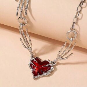 Skeleton-Hand Necklace with Red Heart Pendant